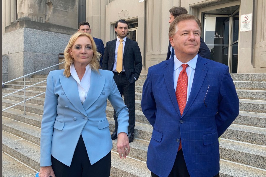 Patricia McCloskey, left, and her husband Mark McCloskey leave a court in St. Louis on June 17, 2021. (Jim Salter/Associated Press)