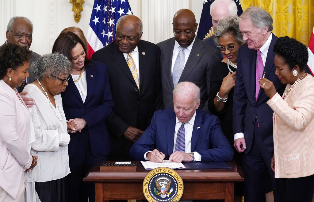 President Joe Biden signs the Juneteenth National Independence Day Act, in the East Room of the White House on June 17, 2021.(Evan Vucci/Associated Press)