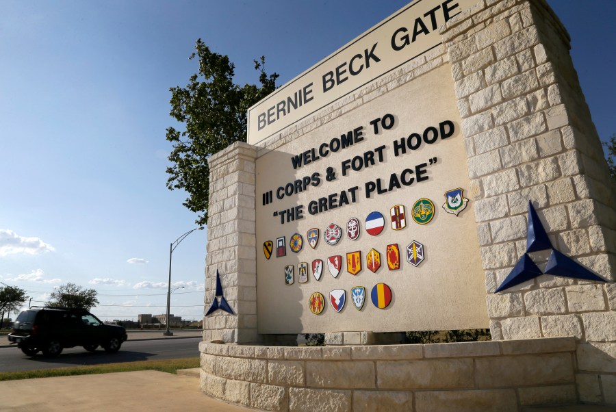 In this July 9, 2013, file photo, traffic flows through the main gate past a welcome sign in Fort Hood, Texas. A new study finds that female soldiers at Army bases in Texas, Colorado, Kansas and Kentucky face a greater risk of sexual assault and harassment than those at other posts, accounting for more than a third of all active duty Army women sexually assaulted in 2018. The study by RAND Corporation was released Friday. (AP Photo/Tony Gutierrez, File)