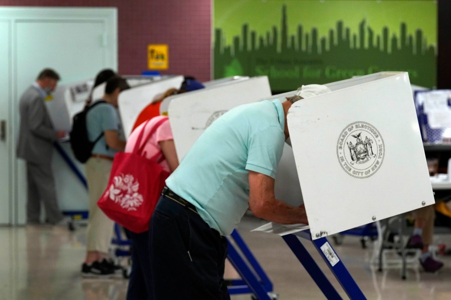 Voters mark their ballots at Frank McCourt High School, in New York, on June 22, 2021. (Richard Drew/Associated Press)