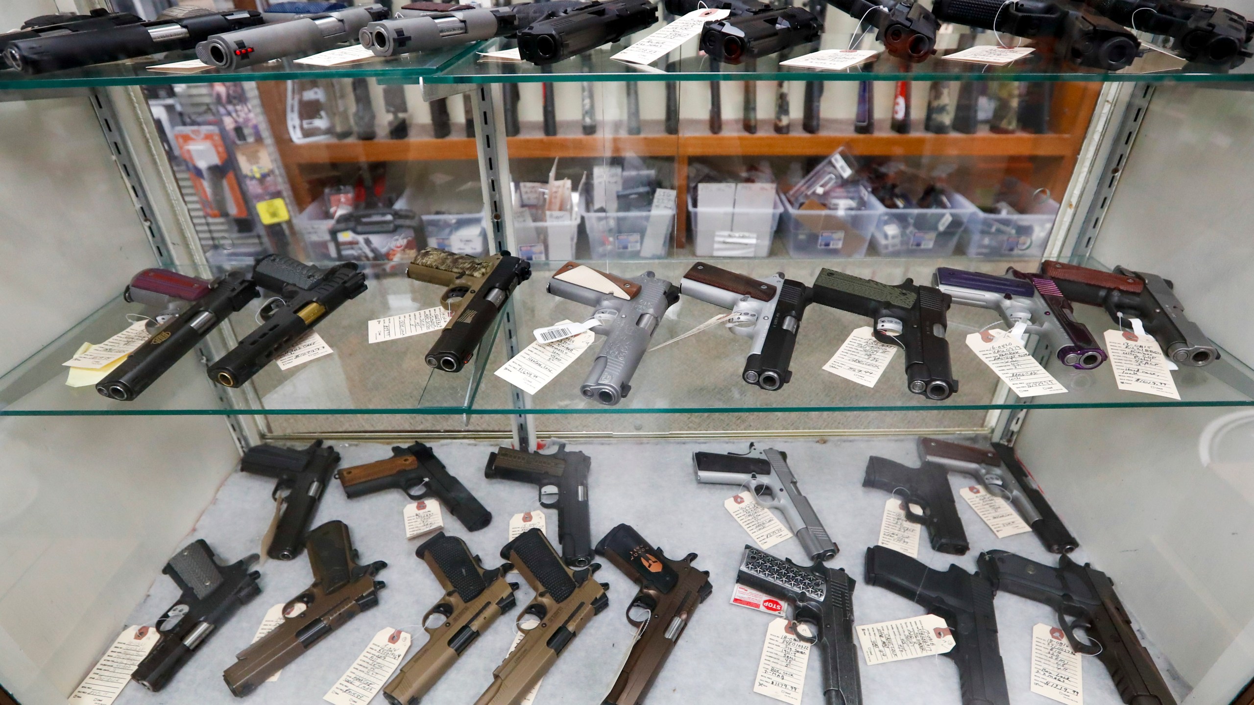 In this March 25, 2020, file photo semi-automatic handguns are displayed at shop in New Castle, Pa. (AP Photo/Keith Srakocic, File)