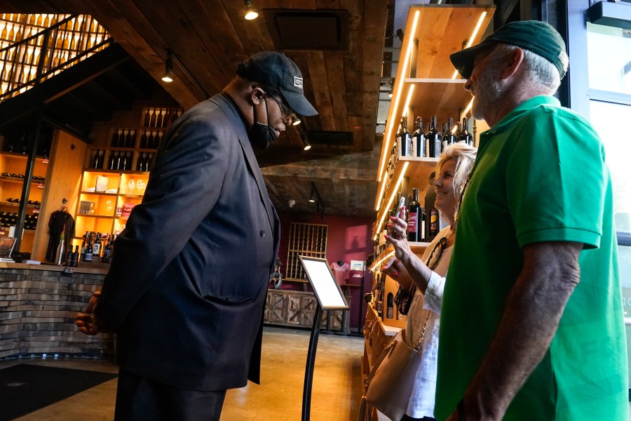 Security personnel ask customers for proof of vaccination as they enter City Winery, Thursday, June 24, 2021, in New York. (AP Photo/Frank Franklin II)