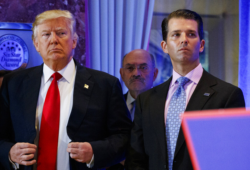 This file photo from Jan. 11, 2017, shows President-elect Donald Trump, left, his chief financial officer Allen Weisselberg, center, and his son Donald Trump Jr., right, attend a news conference in the lobby of Trump Tower in New York. (AP Photo/Evan Vucci, File)