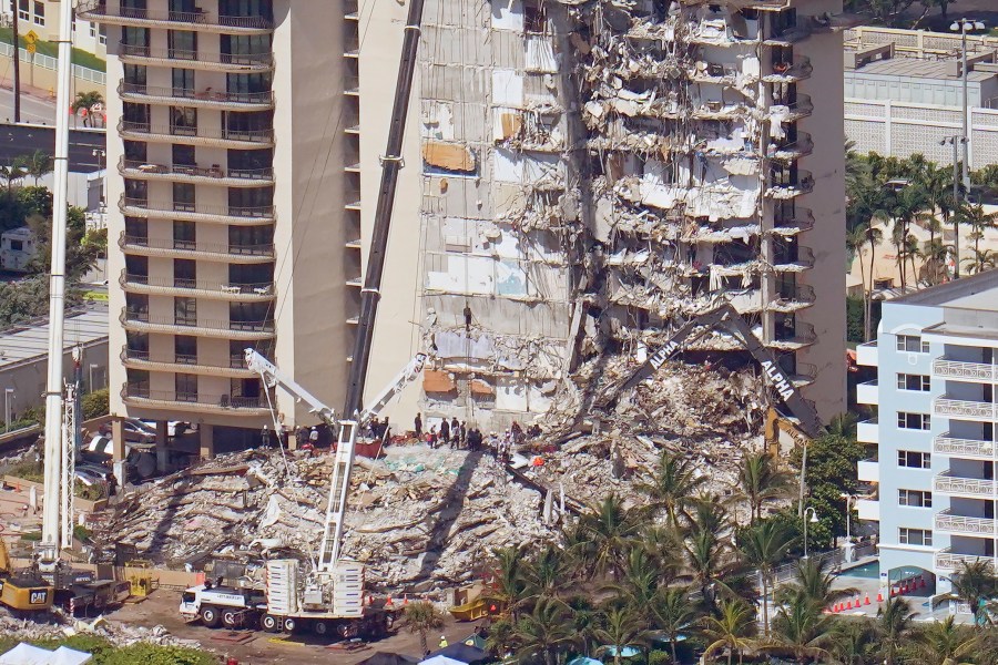 Crews work in the rubble at the Champlain Towers South Condo, Sunday, June 27, 2021, in Surfside, Fla. One hundred fifty-nine people were still unaccounted for two days after Thursday's collapse. (AP Photo/Gerald Herbert)