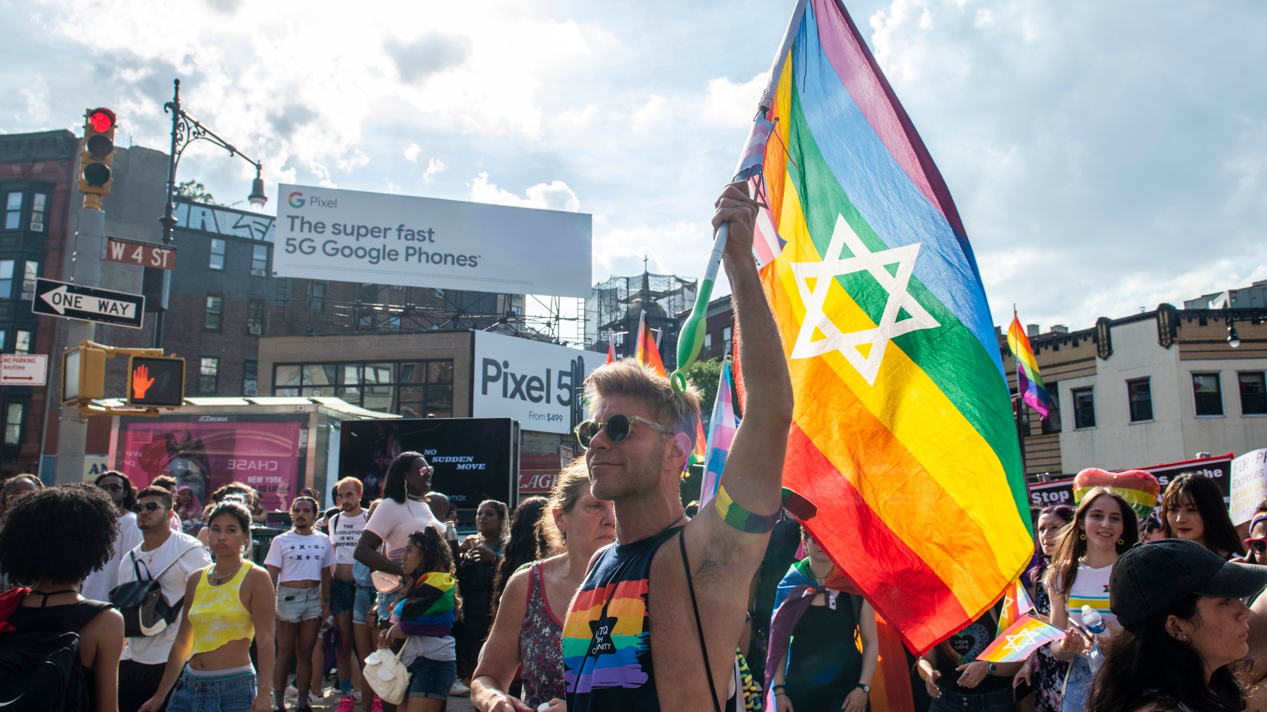 People gather during the Queer Liberation March in the West Village on Sunday, June 27, 2021, in New York. (AP Photo/Brittainy Newman)