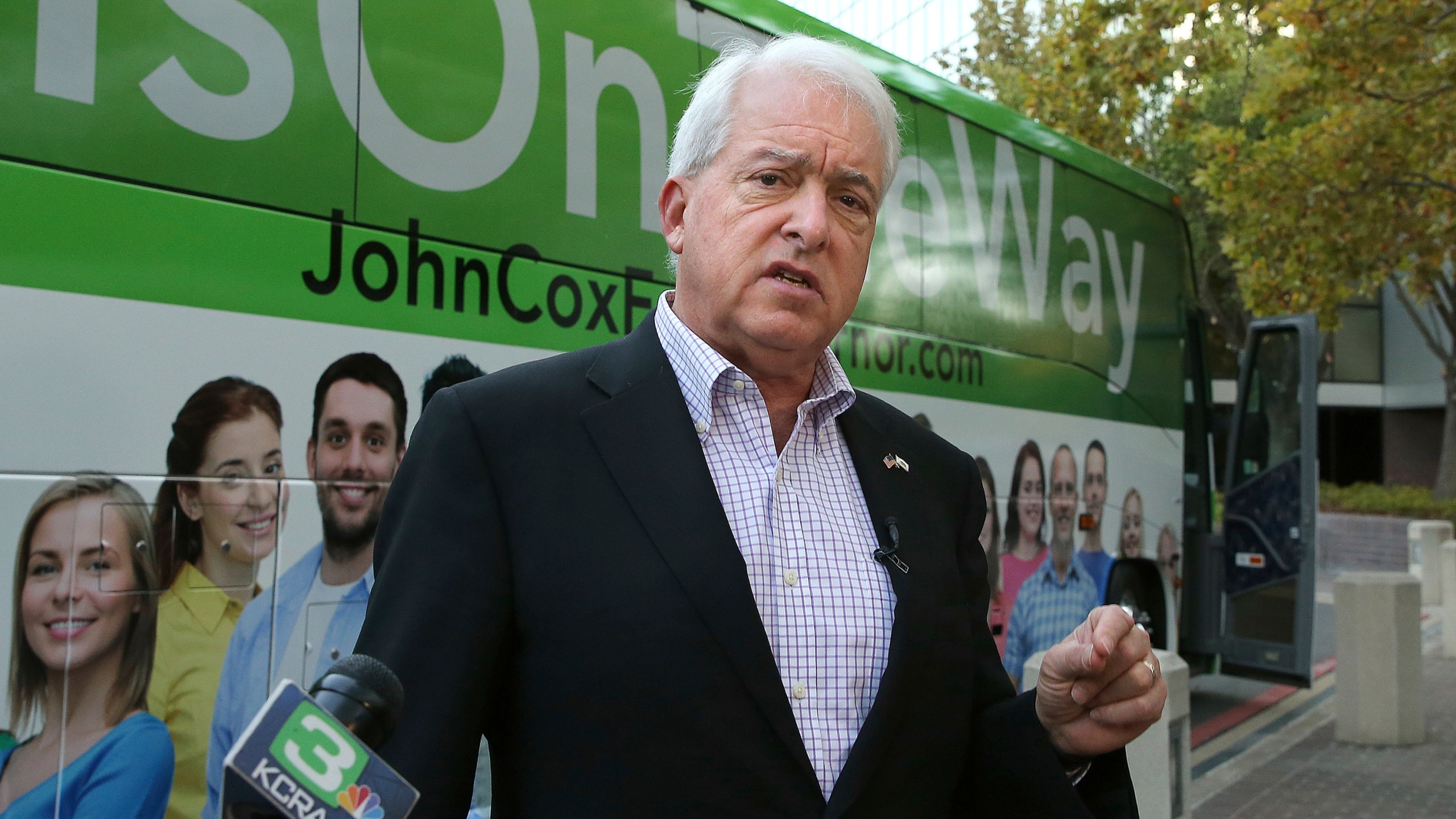 Republican gubernatorial candidate John Cox talks to reporters before beginning a statewide bus tour in Sacramento on Nov. 1, 2018. (Rich Pedroncelli / Associated Press)