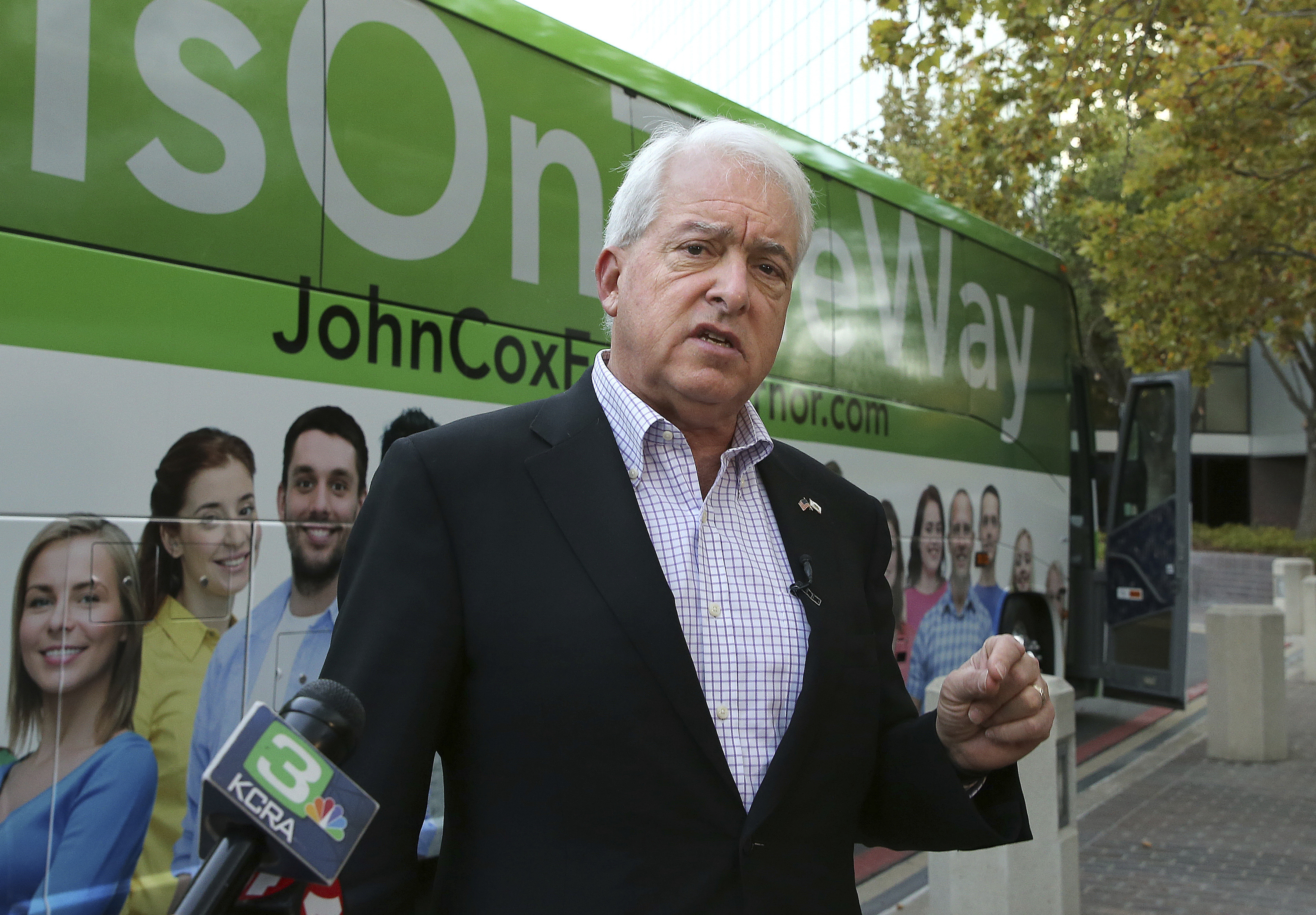 Republican gubernatorial candidate John Cox talks to reporters before beginning a statewide bus tour in Sacramento on Nov. 1, 2018. (Rich Pedroncelli / Associated Press)