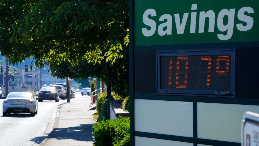 A display at an Olympia Federal Savings branch shows a temperature of 107 degrees Fahrenheit, Monday, June 28, 2021, in the early evening in Olympia, Wash. Seattle, Olympia, and other cities in the Pacific Northwest endured the hottest day of an unprecedented and dangerous heat wave on Monday, with temperatures obliterating records that had been set just the day before on Sunday. (AP Photo/Ted S. Warren)