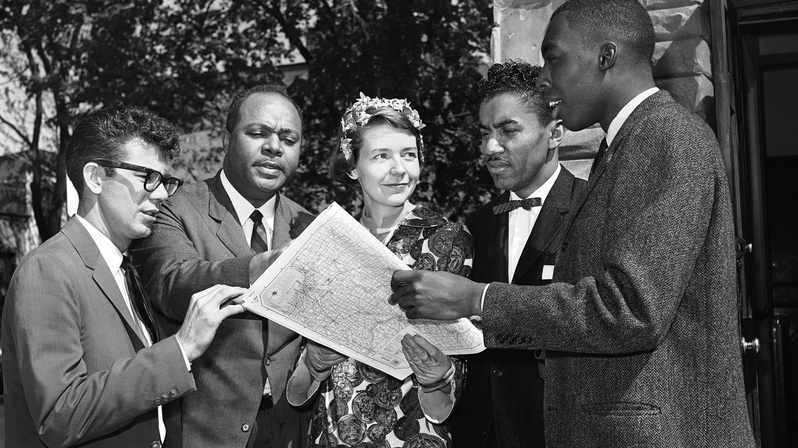 Members of an interracial group pose on May 4, 1961 in Washington with a map of a route they plan to take to test segregation in bus terminal restaurants and rest rooms in the South. (AP Photo/BHR)