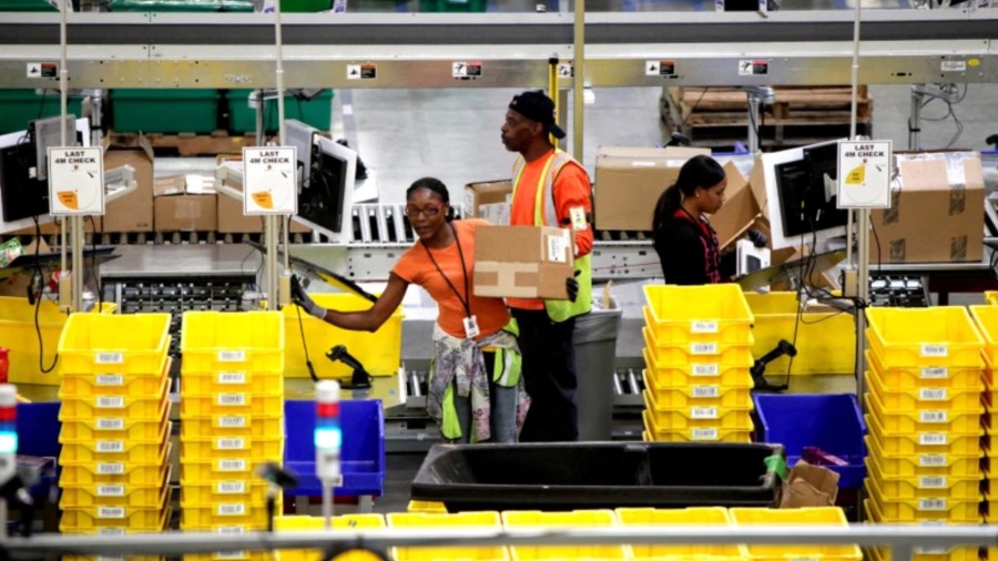 A campaign to unionize Amazon warehouse workers in Alabama earlier this year failed. Above, workers at an Amazon fulfillment center in San Bernardino. (Irfan Khan / Los Angeles Times)