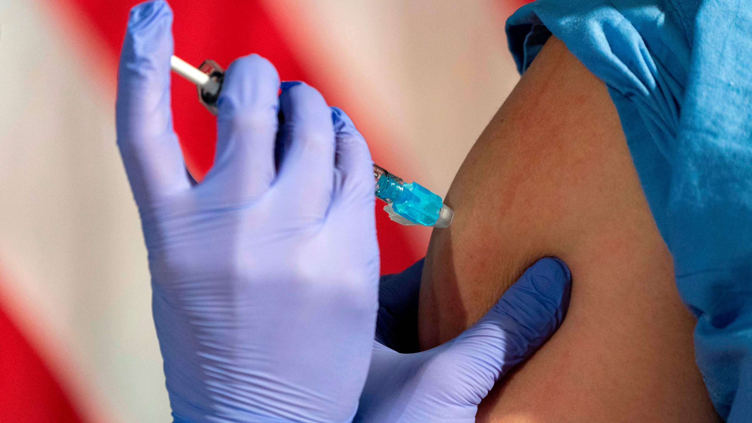 A nurse administers a COVID-19 vaccine on Dec.r 14, 2020, in Washington, DC. (JACQUELYN MARTIN/POOL/AFP via Getty Images)