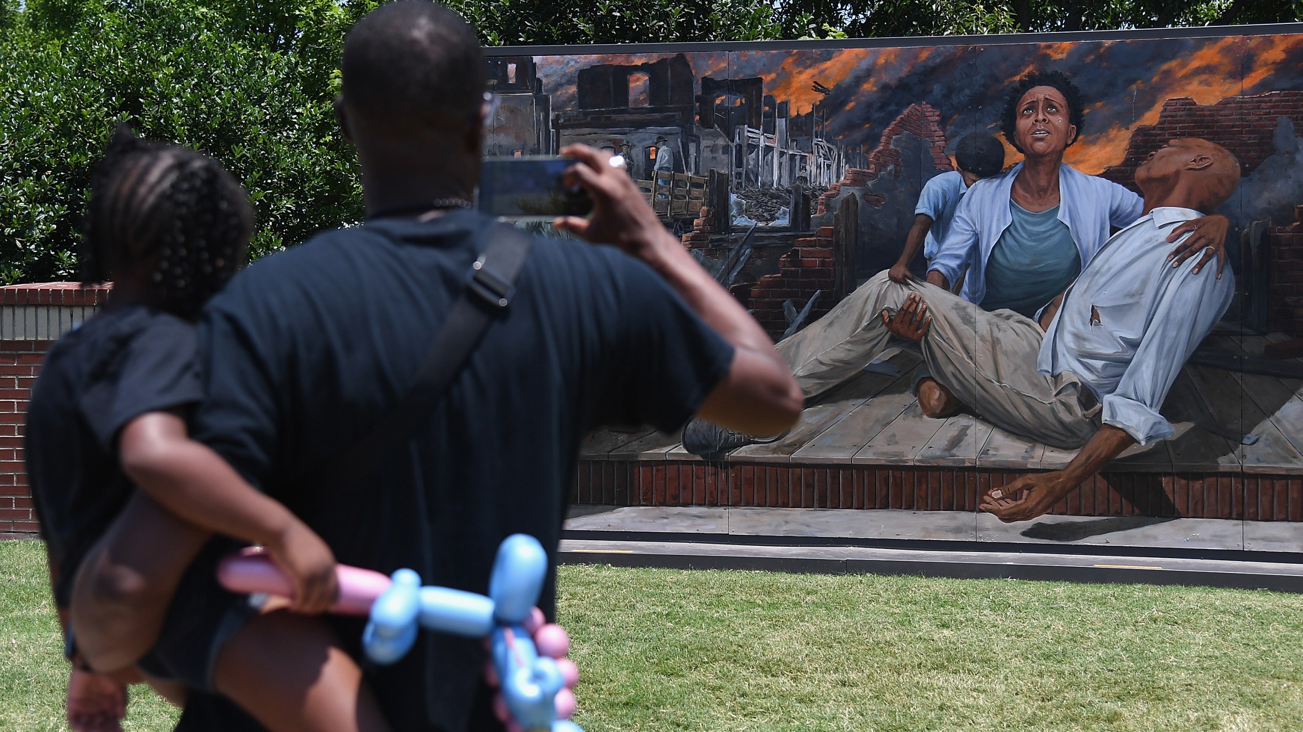 Attendees take in an art installation on Greenwood Avenue during the Juneteenth Festival on June 19, 2021 in Tulsa, Oklahoma. (Michael B. Thomas/Getty Images)