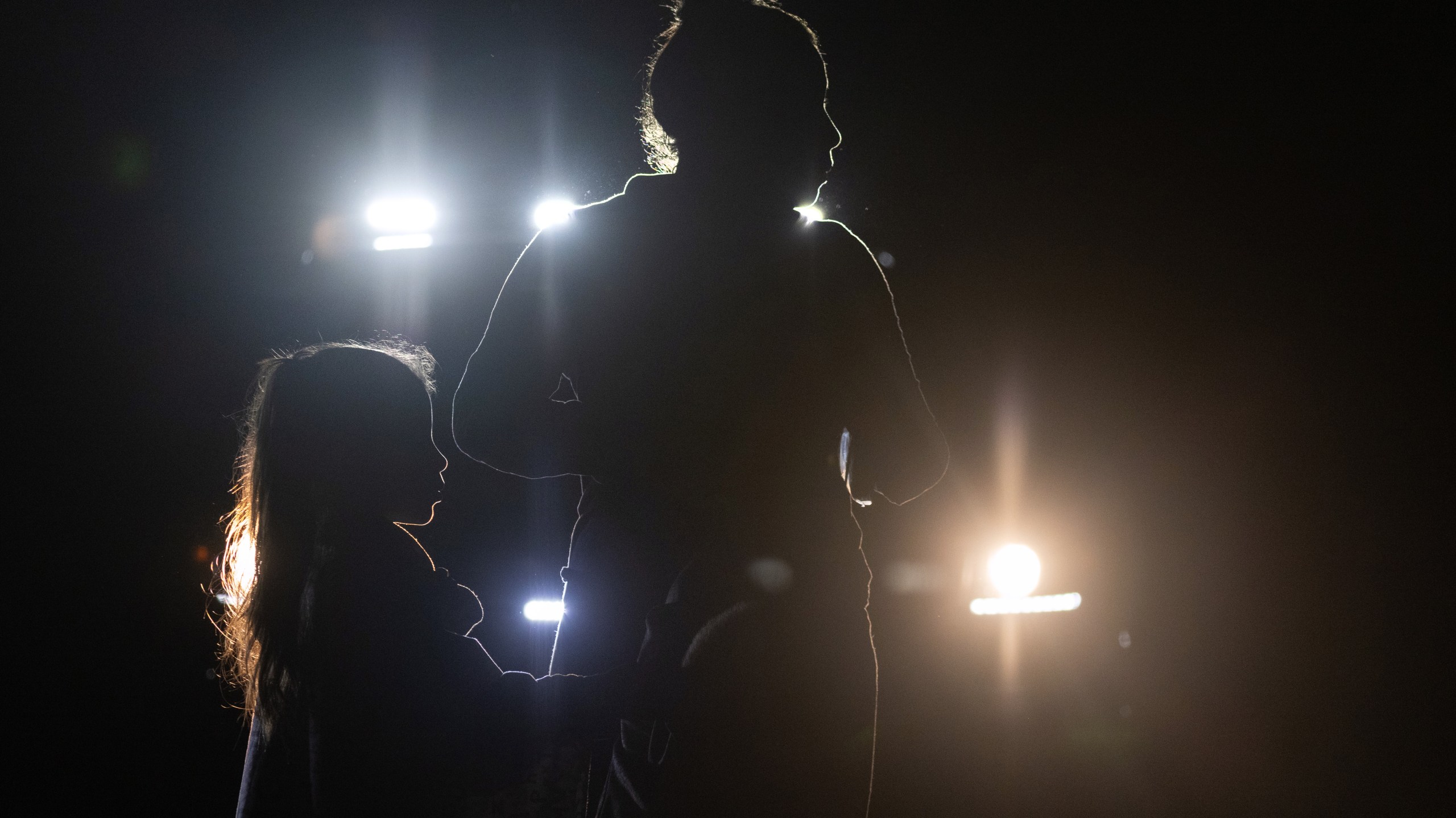 A mother and daughter from Venezuela are taken into U.S. Border Patrol custody on May 19, 2021, in Del Rio, Texas. (John Moore / Getty Images)