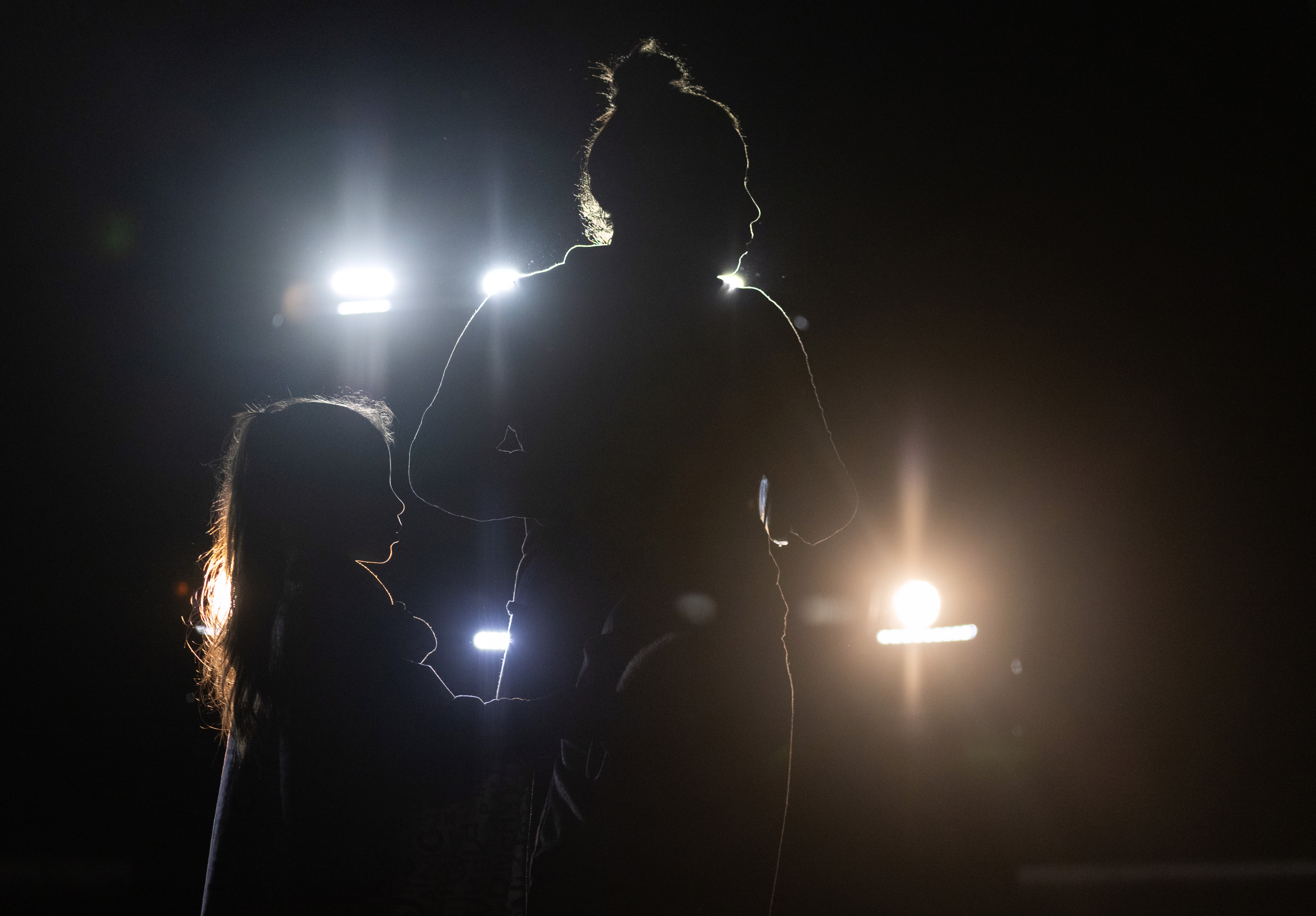 A mother and daughter from Venezuela are taken into U.S. Border Patrol custody on May 19, 2021, in Del Rio, Texas. (John Moore / Getty Images)