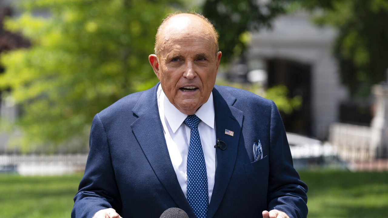 Rudy Giuliani talks with reporters outside the White House on July 1, 2020, in Washington. (AP Photo/Evan Vucci, File)