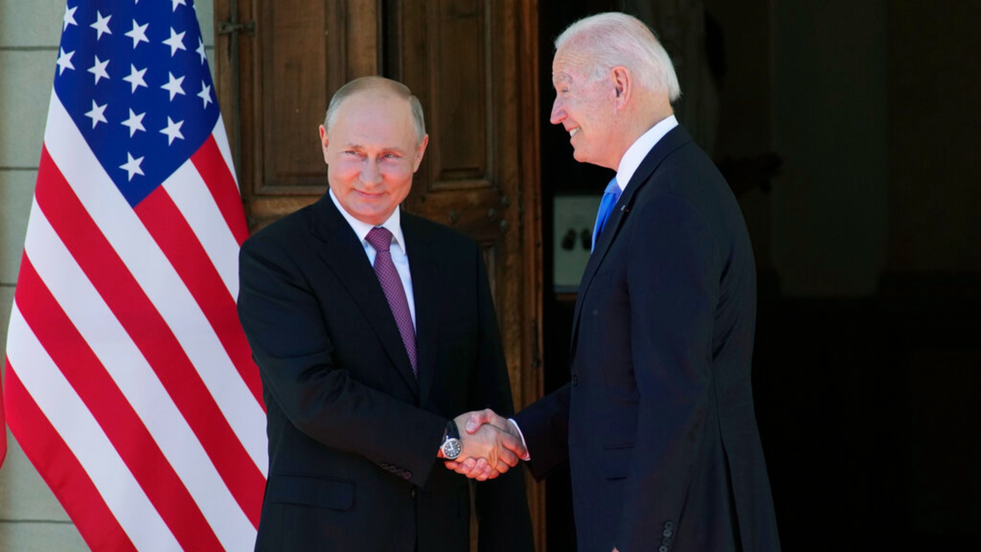 Russian President Vladimir Putin, left, and U.S President Joe Biden shake hands during their meeting at the 'Villa la Grange' in Geneva, Switzerland in Geneva, Switzerland, Wednesday, June 16, 2021. (AP Photo/Alexander Zemlianichenko, Pool)