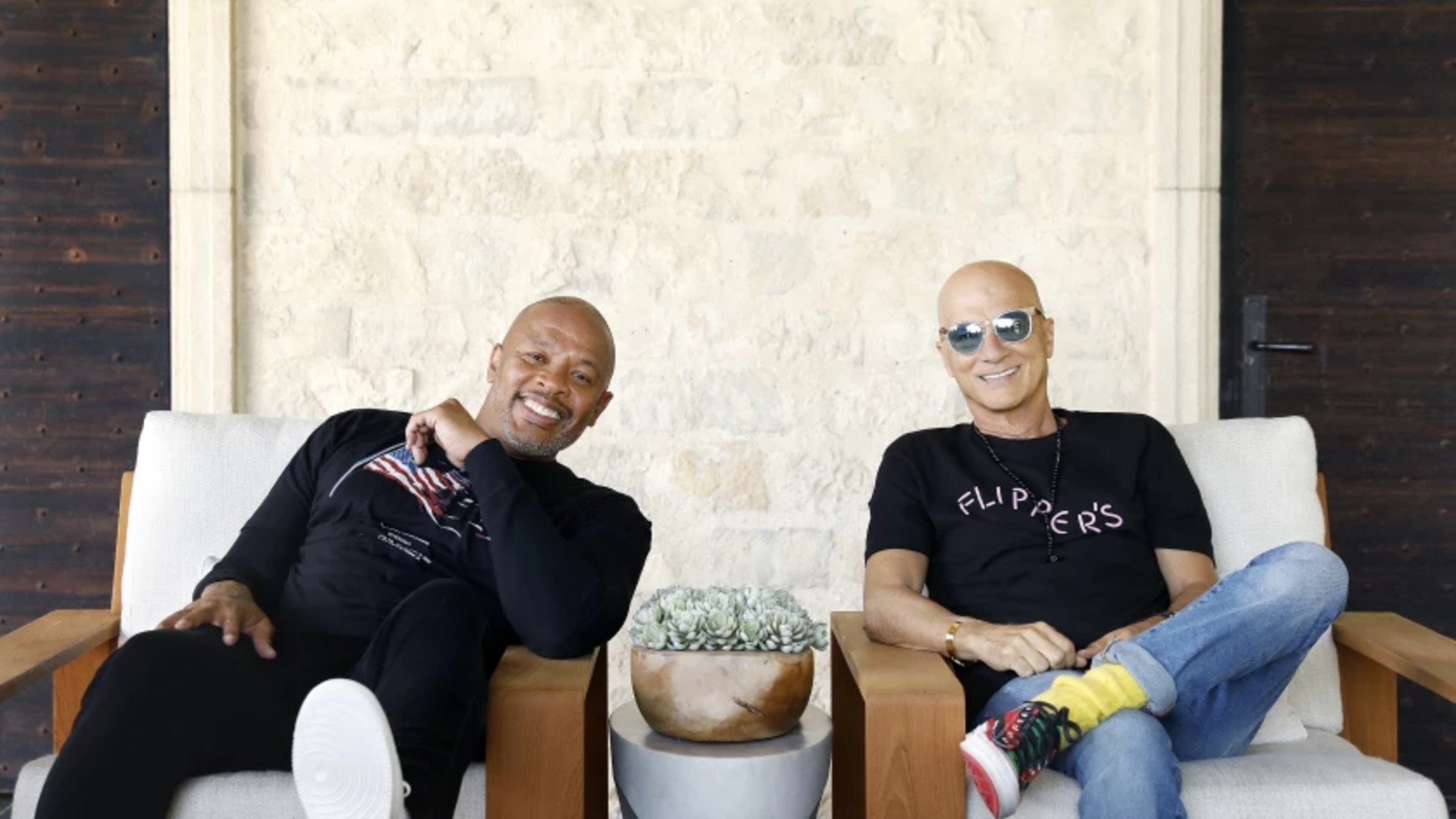 Dr. Dre, left, and Jimmy Iovine, both music moguls from humble roots, are photographed at Dr. Dre’s home in Los Angeles on Friday, June 11, 2021. (Christina House / Los Angeles Times)