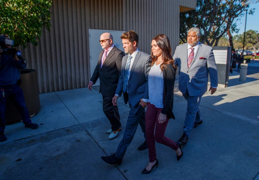 Newport Beach surgeon Grant Robicheaux and girlfriend Cerissa Riley arrive at the Harbor Justice Center for a hearing in 2020.(Allen J. Schaben / Los Angeles Times)