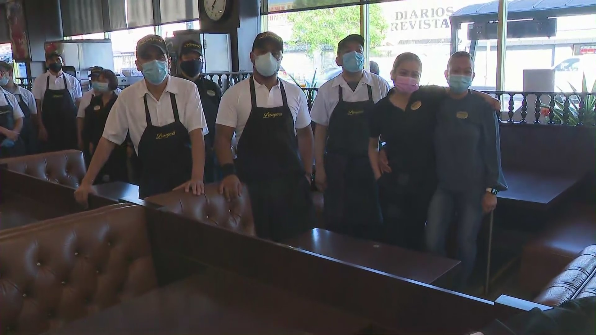 Employees at Langer's Deli in Los Angeles celebrate its full reopening on June 15, 2021. (KTLA)