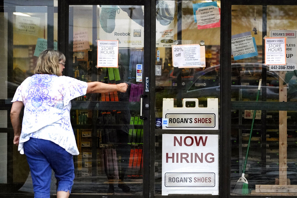 A hiring sign is displayed outside a retail store in Buffalo Grove, Ill., Thursday, June 24, 2021. (AP Photo/Nam Y. Huh)