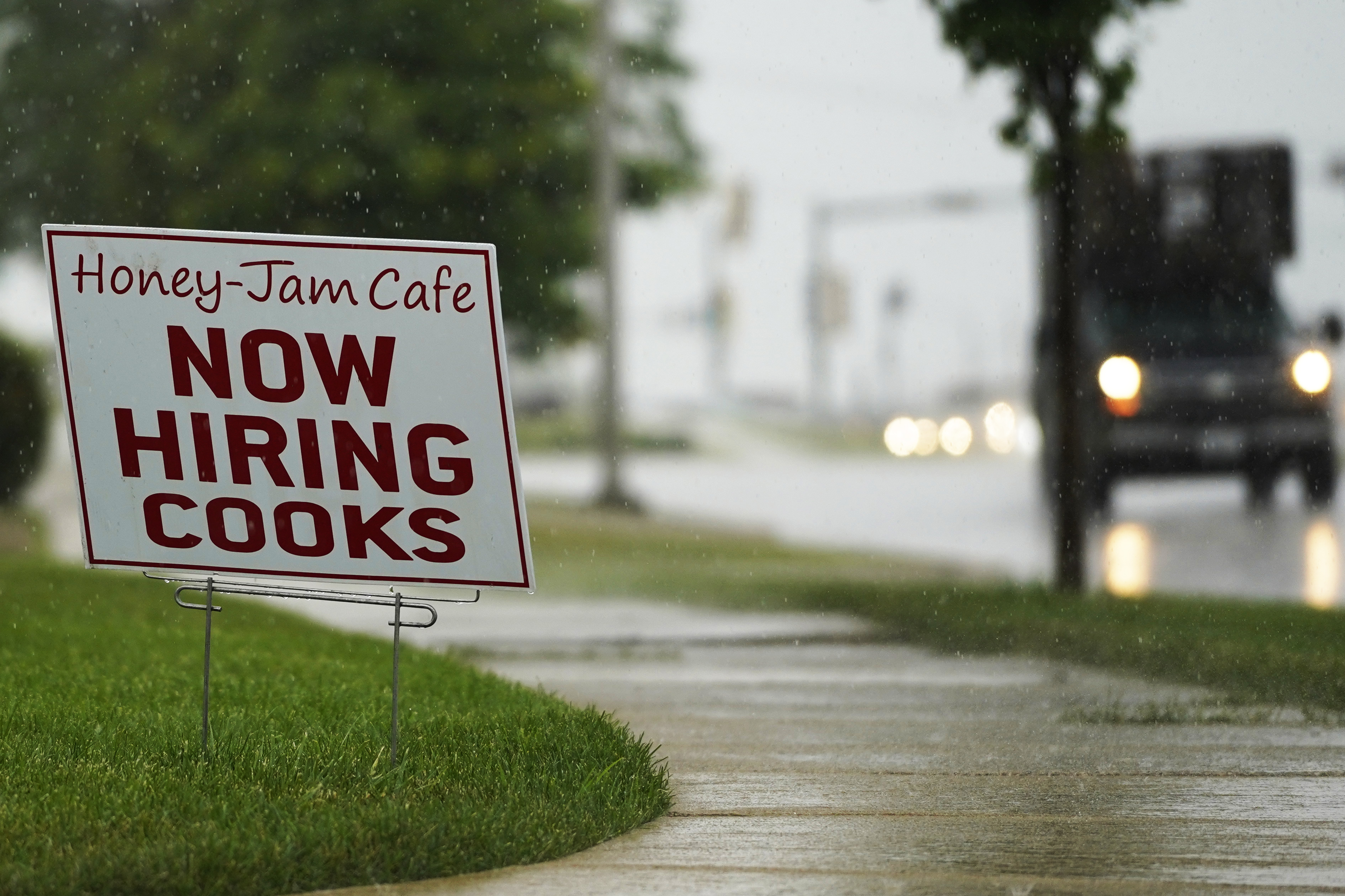 A hiring sign is shown in Downers Grove, Ill., Thursday, June 24, 2021. The number of Americans collecting unemployment benefits slid last week, another sign that the job market continues to recover rapidly from the coronavirus recession. Jobless claims dropped by 24,000 to 400,000 last week, the Labor Department reported Thursday, July 29, 2021. (AP Photo/Nam Y. Huh, File)