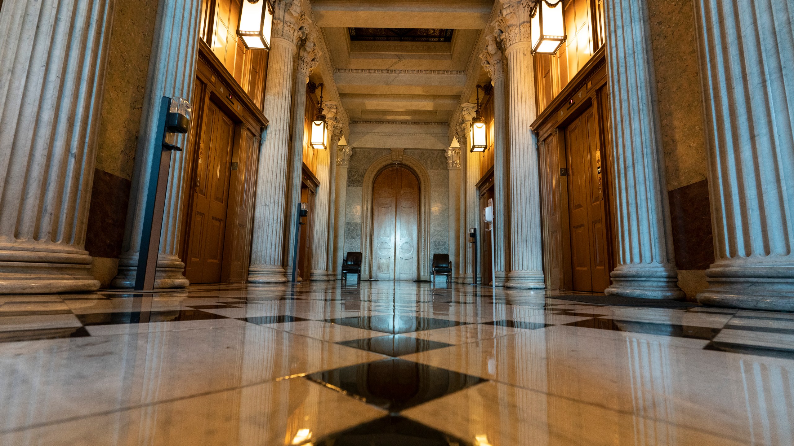 This June 30, 2021, photo shows the halls of the Capitol outside the Senate in Washington. The U.S. Capitol is still closed to most public visitors. It's the longest stretch ever that the building has been off-limits in its 200-plus year history. (AP Photo/Alex Brandon)