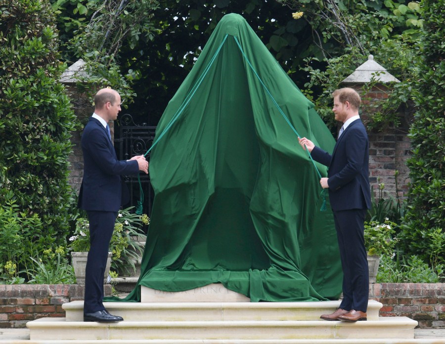 Britain's Prince William, left and Prince Harry unveil a statue they commissioned of their mother Princess Diana,  on what woud have been her 60th birthday, in the Sunken Garden at Kensington Palace, London, Thursday July 1, 2021. (Dominic Lipinski /Pool Photo via AP)