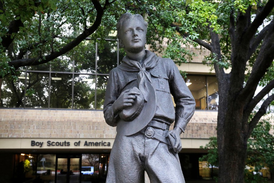 In this Feb. 12, 2020 file photo, a statue stands outside the Boy Scouts of America headquarters in Irving, Texas. The Boy Scouts of America have reached an agreement with attorneys representing some 60,000 victims of child sex abuse in what could prove to be a pivotal moment in the organization’s bankruptcy case. Attorneys for the BSA filed court papers late Thursday, July 1, 2021 outlining a restructuring support agreement, or RSA, with attorneys representing abuse victims. (AP Photo/LM Otero, File)