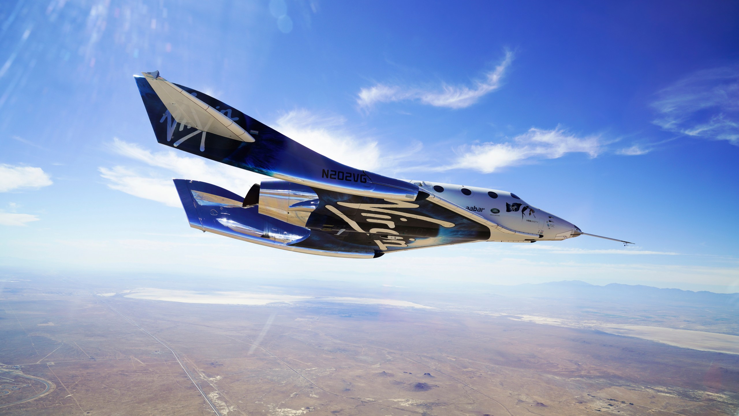 This May 29, 2018 photo made available by Virgin Galactic shows the company's VSS Unity on its second supersonic flight. After reaching nearly 50,000 feet (15,000 meters), Unity will be released from the specially designed aircraft Mothership Eve, and drop for a moment or two before its rocket motor ignites to send the craft on a steep climb toward space. (Virgin Galactic via AP)