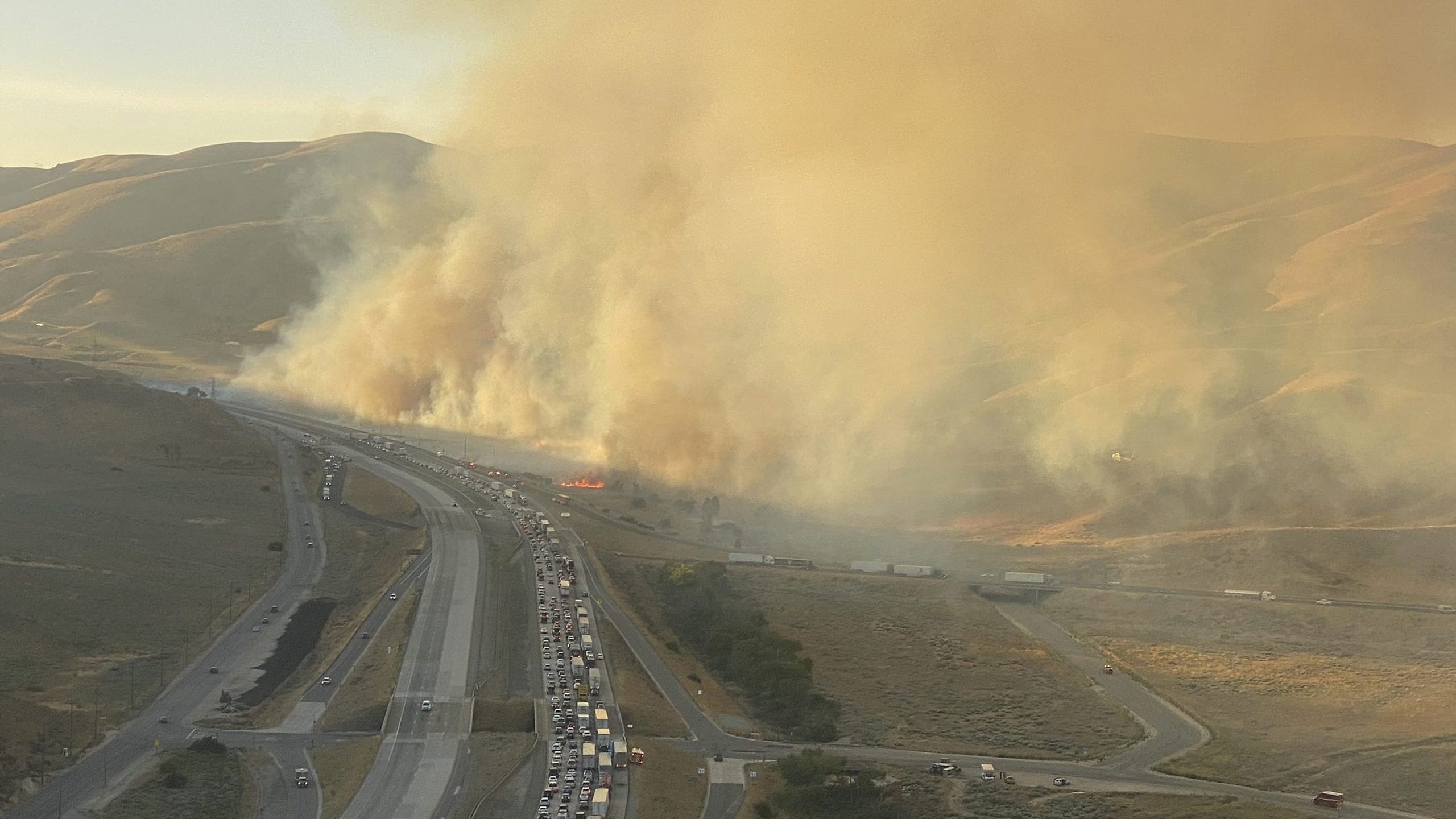 This aerial picture released via @LACoFireAirOps by the Los Angeles County Fire Department Air Operations shows the Tumbleweed Fire along the 5 Freeway in Gorman on July 4, 2021.