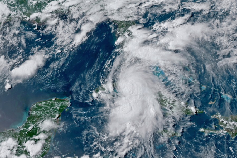 This GOES-16 GeoColor satellite image taken July 5, 2021, at 4:50 p.m. EDT, and provided by NOAA, shows Tropical Storm Elsa over western Cuba with strong rain and winds. (NOAA via Associated Press)