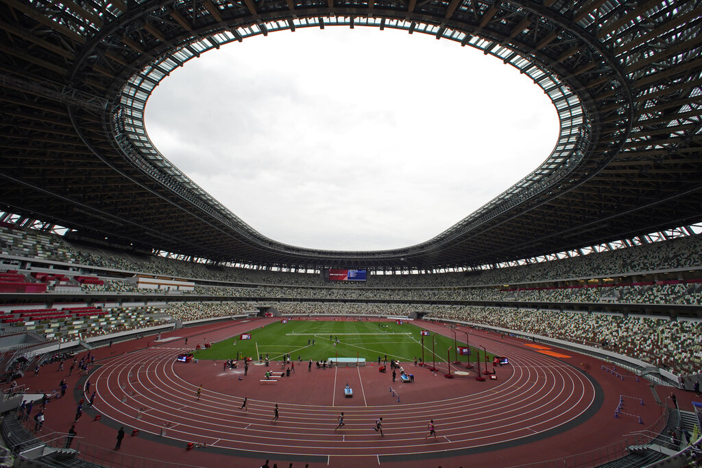 In this May 11, 2021, file photo, athletes compete in the men's 400-meter T20 race during an athletics test event for the Tokyo 2020 Paralympics Games at National Stadium in Tokyo. (AP Photo/Shuji Kajiyama, File)