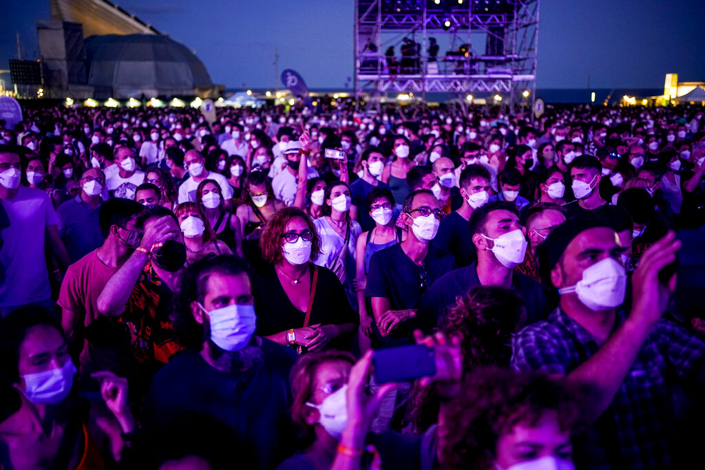 People attend the Cruilla music festival in Barcelona, Spain, Friday, July 9, 2021. (AP Photo/Joan Mateu)