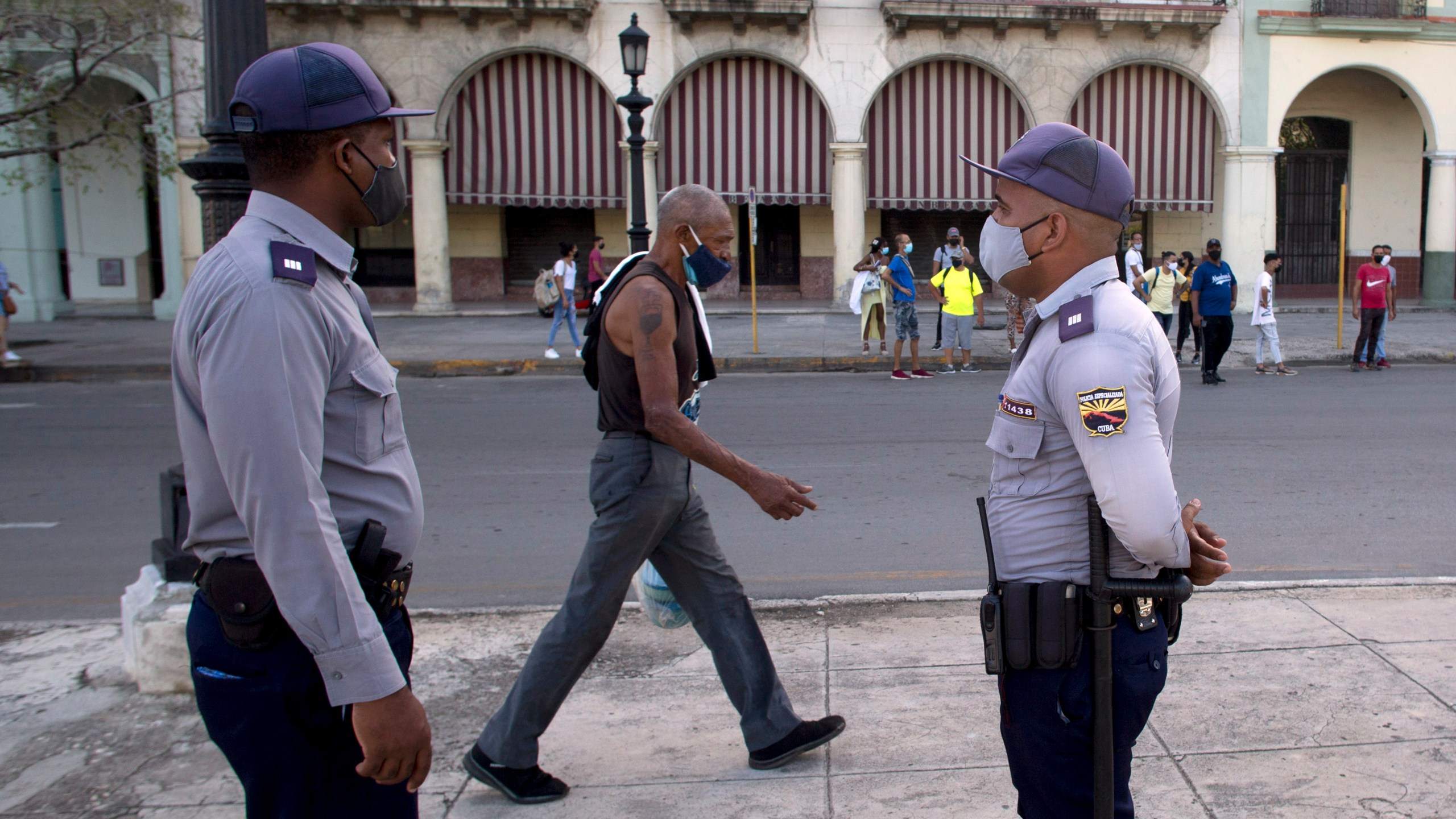 Police stand guard near the National Capitol building in Havana, Cuba July 12 the day after protests against food shortages and high prices amid the coronavirus crisis. (Ismael Francisco/ Associated Press)