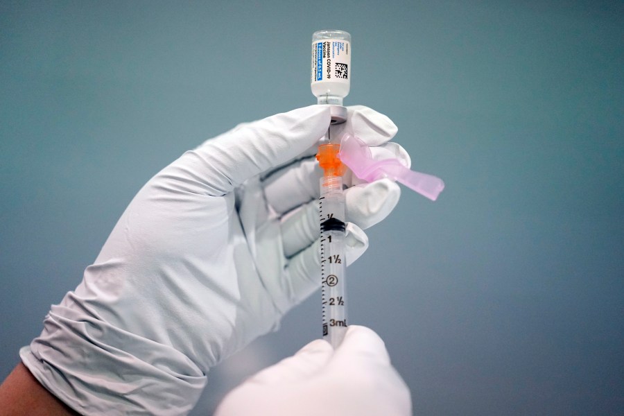 In this March 26, 2021, file photo a member of the Philadelphia Fire Department prepares a dose of the Johnson & Johnson COVID-19 vaccine at a vaccination site setup in Philadelphia. (AP Photo/Matt Rourke, File)