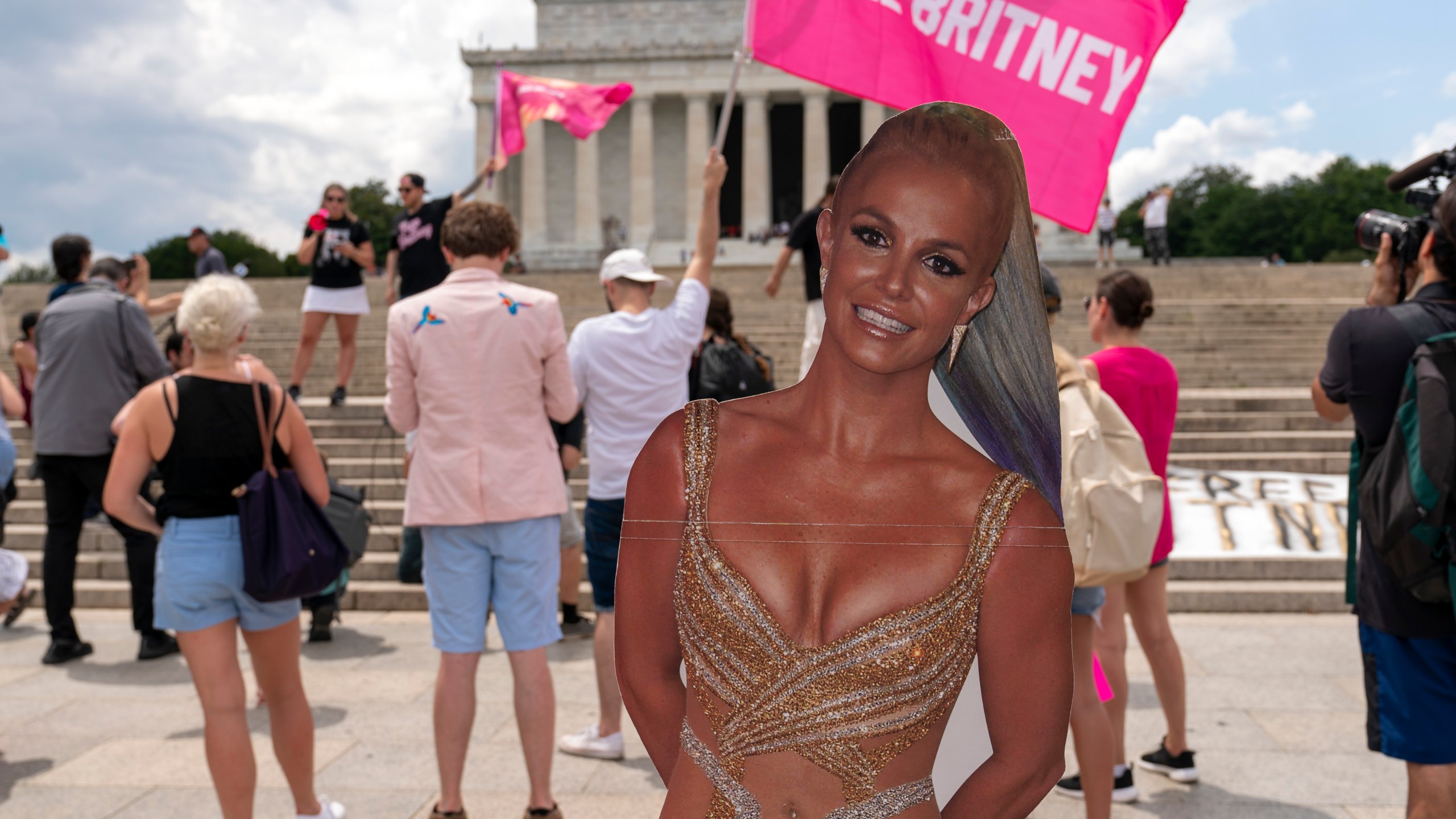 Fans and supporters of pop star Britney Spears protest at the Lincoln Memorial, during the "Free Britney" rally, Wednesday, July 14, 2021, in Washington. Rallies have been taking place across the country since the pop star spoke out against her conservatorship in court last month. (AP Photo/Jose Luis Magana)