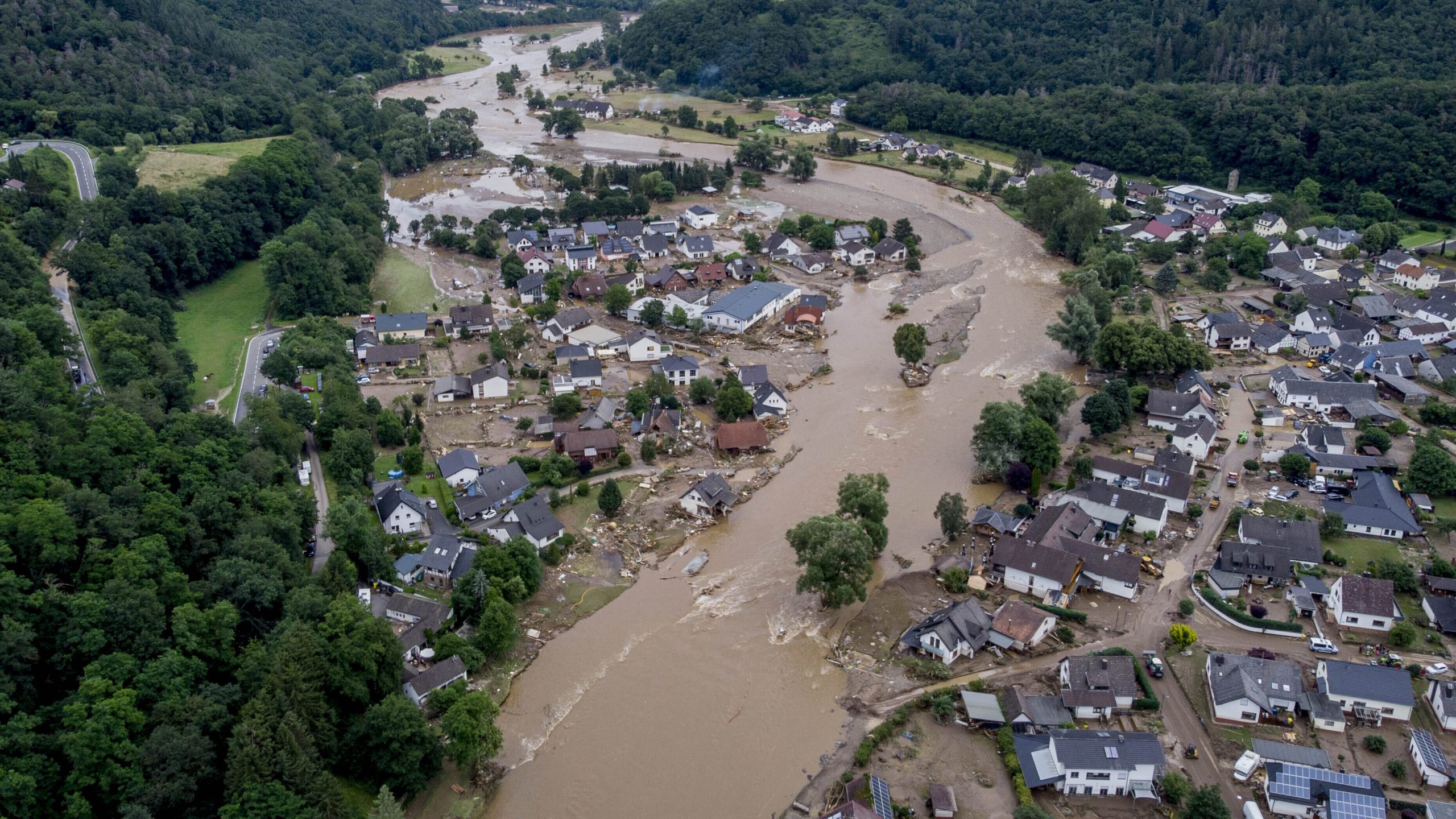 The Ahr river floats past destroyed houses in Insul, Germany, on July 15, 2021. (Michael Probst / Associated Press)