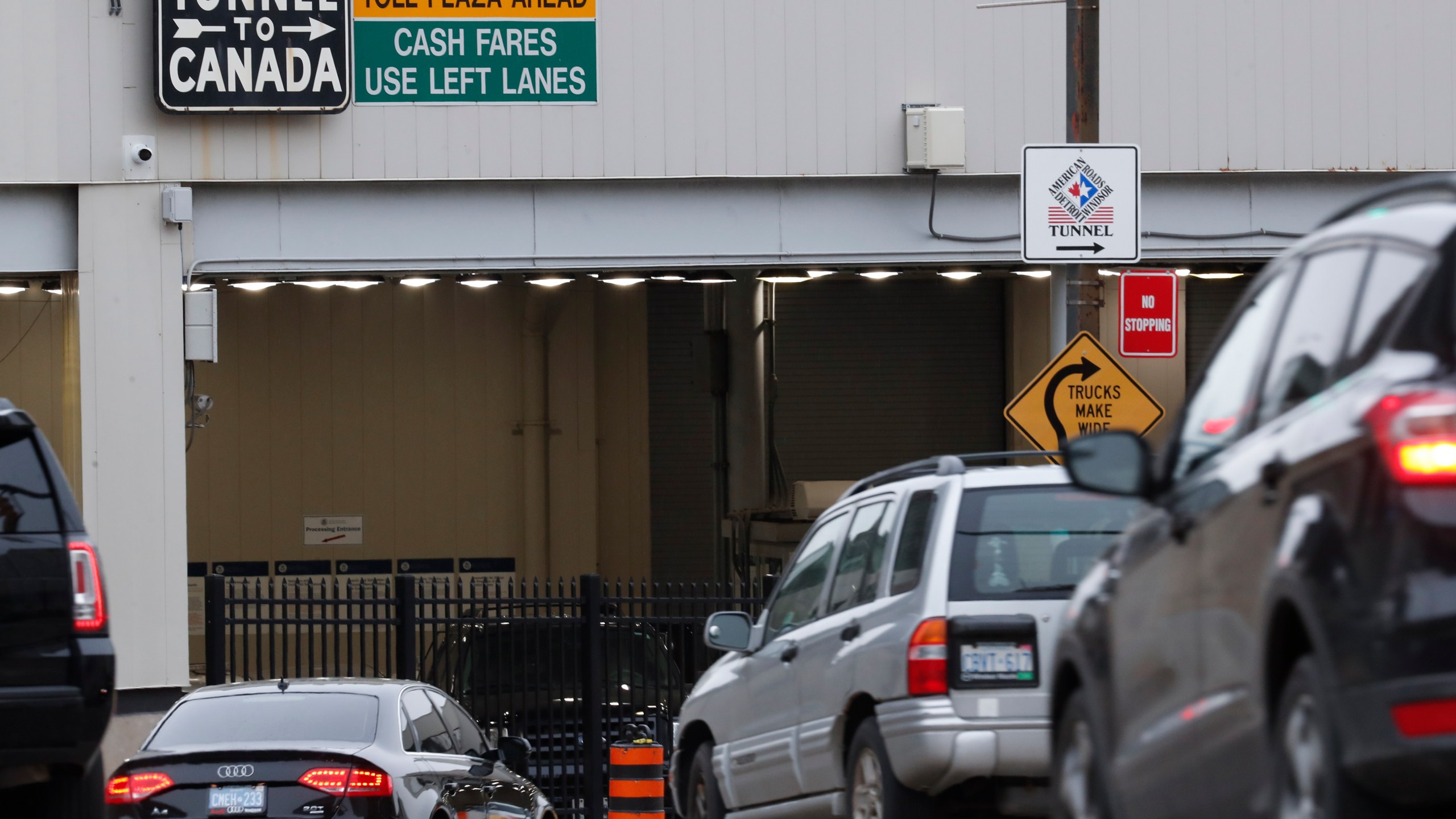 In this March 16, 2020, file photo, vehicles enter the Detroit-Windsor Tunnel in Detroit to travel to Canada. (Paul Sancya/Associated Press)