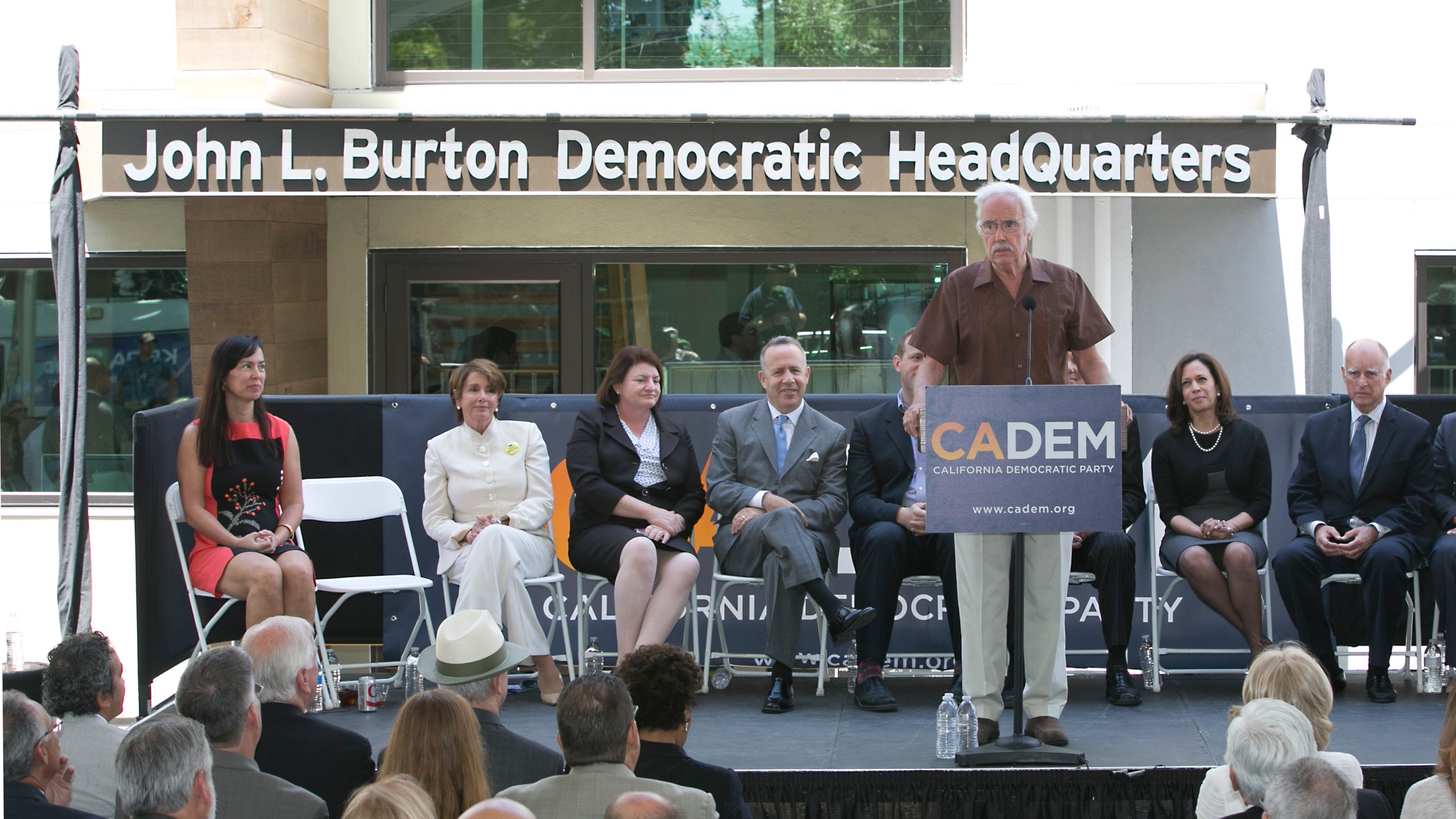 In this June 16, 2014, file photo. then-California Democratic Party Chairman John Burton speaks during the dedication of the John L. Burton California Democratic Party Headquarters in Sacramento, Calif., in Sacramento, Calif. Two California men have been charged with plotting to blow up the state Democratic Party's headquarters in Sacramento, a bombing they hoped would be the first in a series of politically-motivated attacks, federal prosecutors said Thursday, July 15, 2021. From left are then-House Minority Leader Nancy Pelosi, then-Assembly Speaker Toni Atkins, then-state Senate President Pro Term Darrell Steinberg. At right is then-Gov. Jerry Brown and second from right is then-California Attorney General Kamala Harris. (AP Photo/Rich Pedroncelli, File)