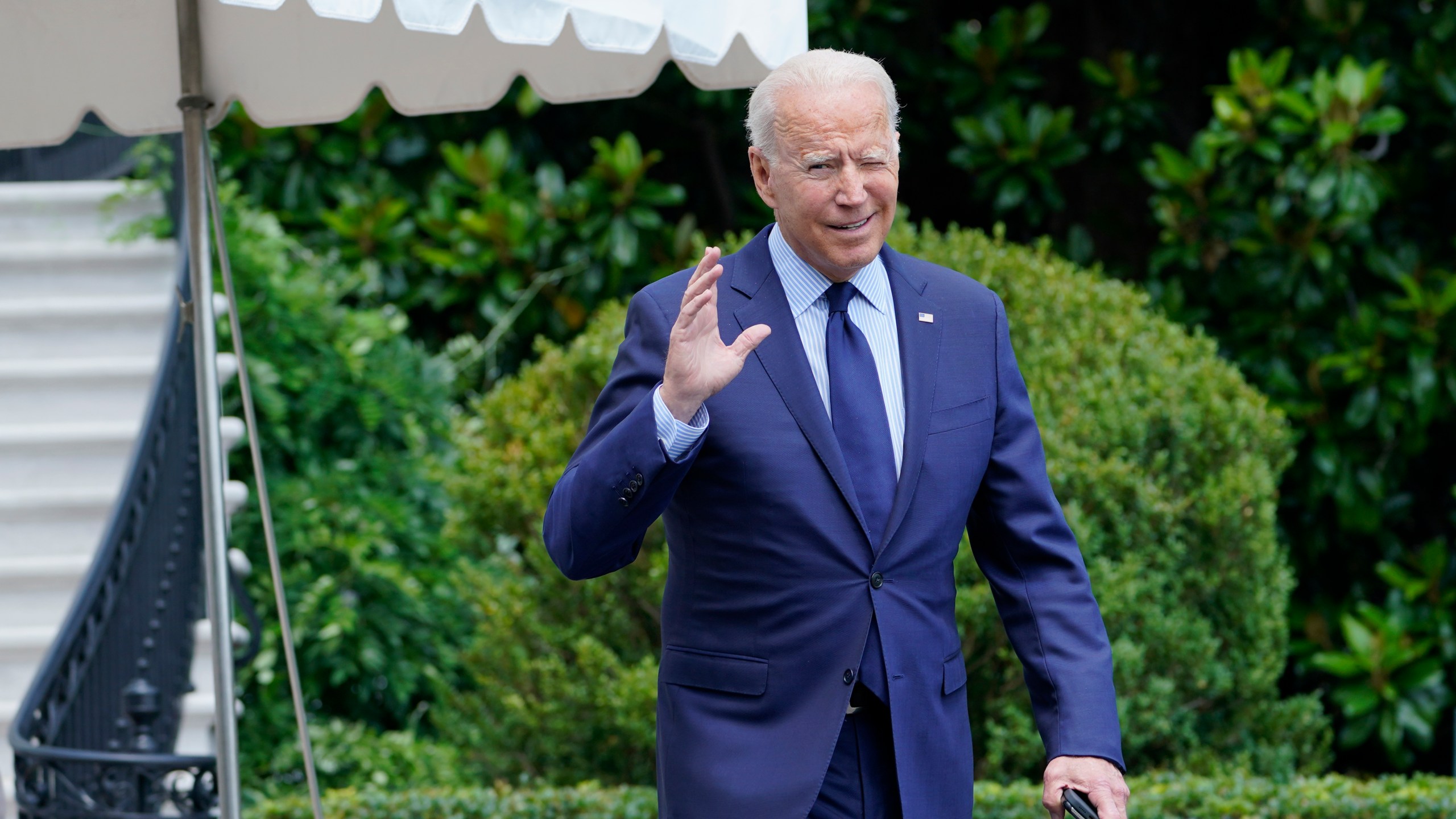 President Joe Biden tries to hear questions shouted by reporters as he heads to Marine One on the South Lawn of the White House in Washington, Friday, July 16, 2021, to spend the weekend at Camp David. (AP Photo/Susan Walsh)