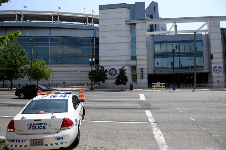 A police car is seen across from Nationals Park, Sunday, July 18, 2021, in Washington. (AP Photo/Nick Wass)