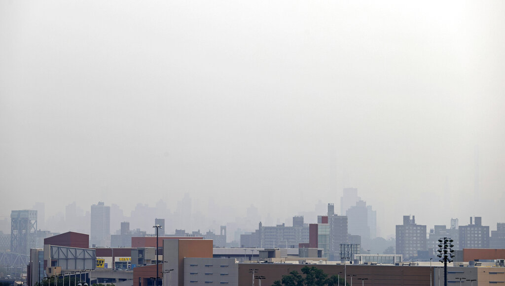 Smoke blocks the view looking toward Manhattan from Yankee Stadium before the Philadelphia Phillies played the New York Yankees in a baseball game Tuesday, July 20, 2021, in New York. (AP Photo/Adam Hunger)