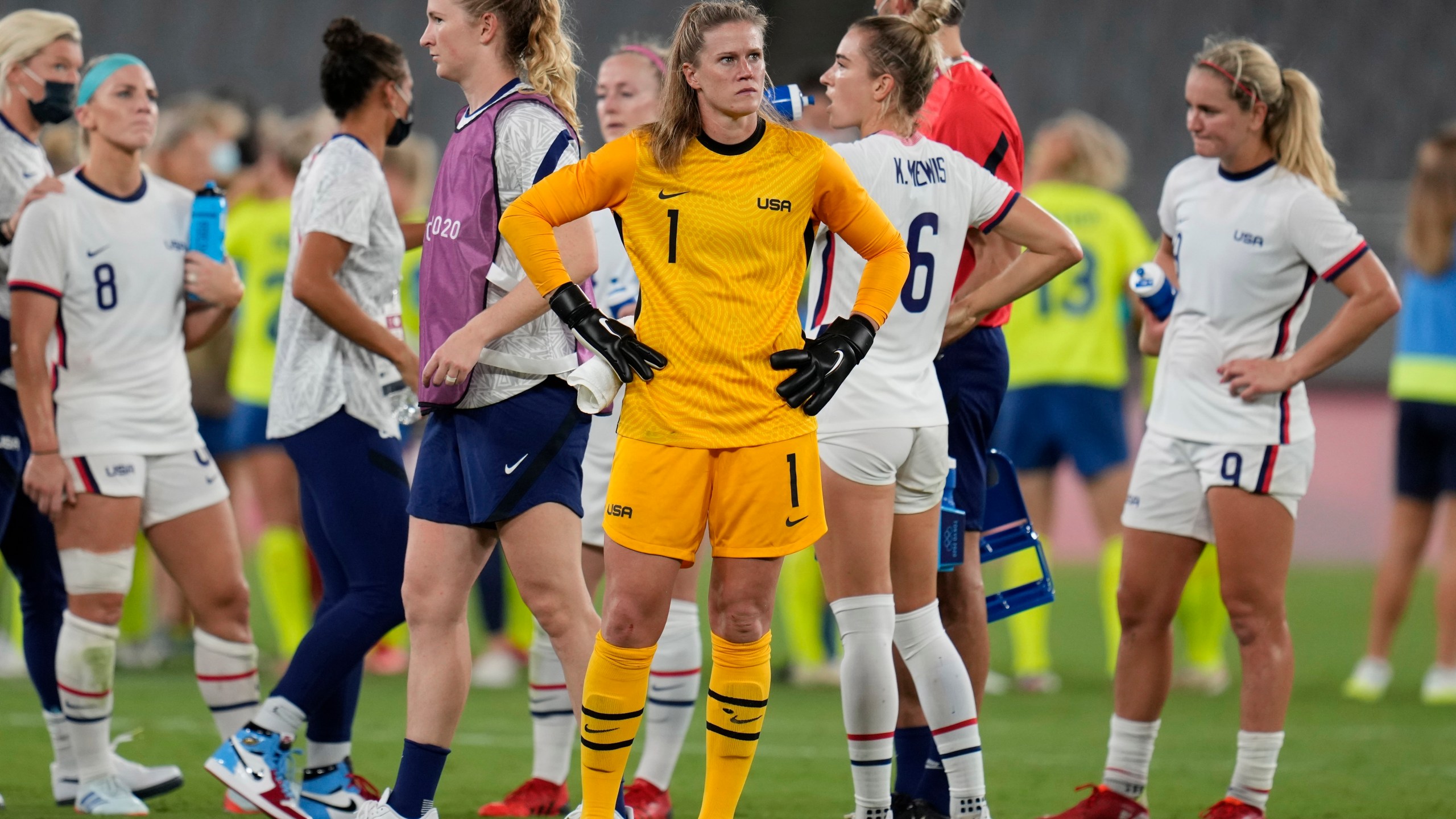 United States' goalkeeper Alyssa Naeher, center, reacts at the end of a women's soccer match against Sweden at the 2020 Summer Olympics, Wednesday, July 21, 2021, in Tokyo. Sweden won 3-0. (AP Photo/Ricardo Mazalan)