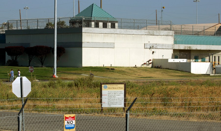 In this July 20, 2006, file photo, the Federal Correctional Institution in Dublin, Calif. Federal investigators have questioned the warden of the federal women's prison in California and searched his office. It comes weeks after a former correctional officer at the facility was arrested on charges of sexually abusing inmates. It wasn't immediately clear if the search at the Federal Correctional Institution at Dublin was connected to last month's arrest. (AP Photo/Ben Margot, File)