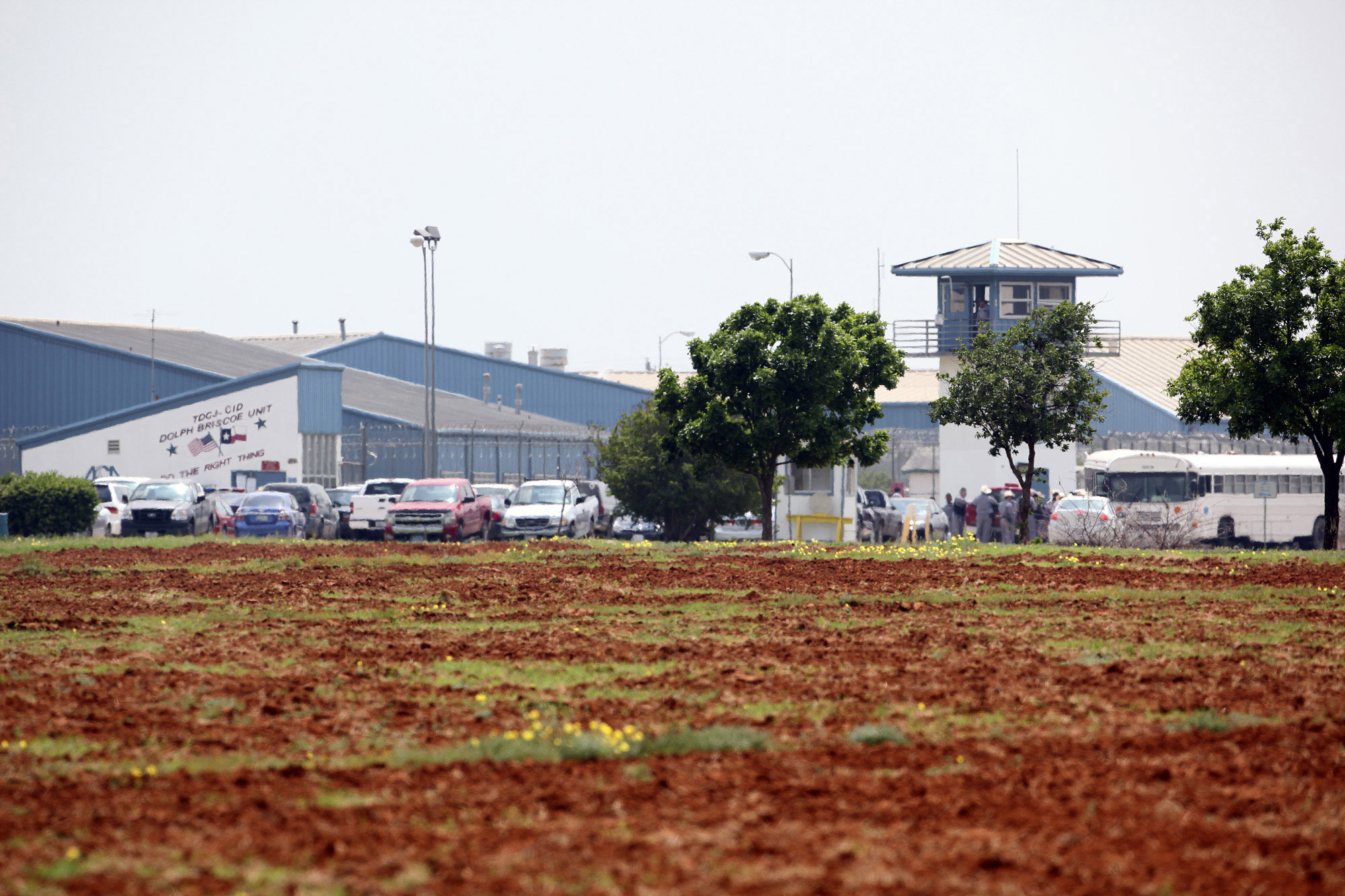 This April 6, 2010, file photo, shows the Dolph Briscoe Unit correctional facility in Dilley, Texas, after two prisoners escaped from the facility. Texas is beginning to arrest and jail migrants who cross the U.S.-Mexico border on state charges such as trespassing, putting at least 10 suspects so far this week into the former state prison that can hold up to 1,000 inmates, officials said Thursday, July 22, 2021. (Tom Reel/The San Antonio Express-News via AP)