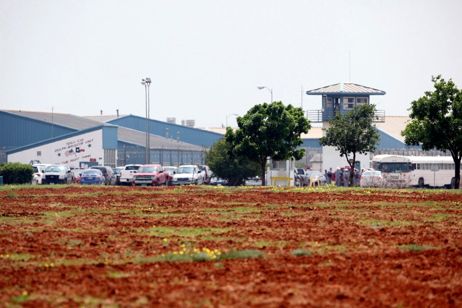 This April 6, 2010, file photo, shows the Dolph Briscoe Unit correctional facility in Dilley, Texas, after two prisoners escaped from the facility. Texas is beginning to arrest and jail migrants who cross the U.S.-Mexico border on state charges such as trespassing, putting at least 10 suspects so far this week into the former state prison that can hold up to 1,000 inmates, officials said Thursday, July 22, 2021. (Tom Reel/The San Antonio Express-News via AP)