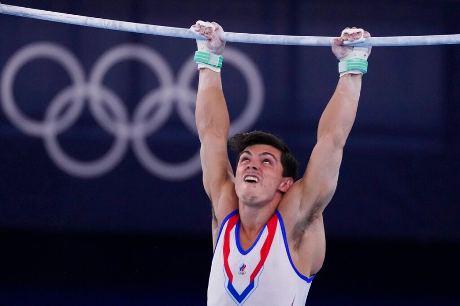 Artur Dalaloyan, of the Russian Olympic Committee, performs on the horizontal bar during the artistic men's team final at the 2020 Summer Olympics, Monday, July 26, 2021, in Tokyo. (AP Photo/Ashley Landis)