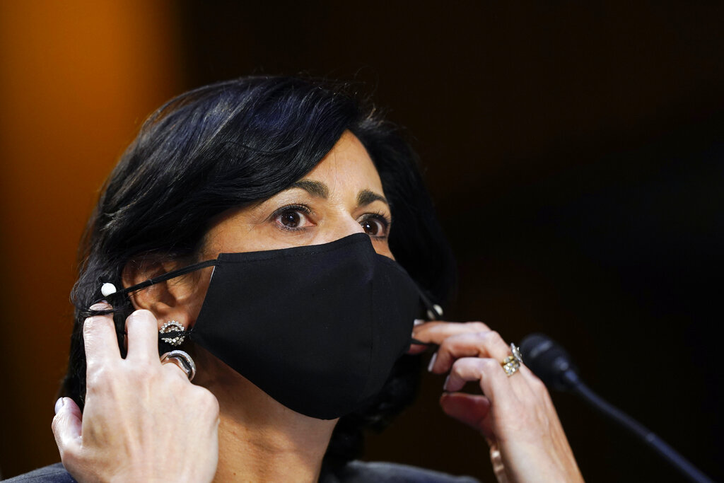 Dr. Rochelle Walensky, director of the Centers for Disease Control and Prevention, adjusts her face mask during a Senate Health, Education, Labor and Pensions Committee hearing on the federal coronavirus response on Capitol Hill in Washington, in this Thursday, March 18, 2021, file photo. (AP Photo/Susan Walsh, Pool, File)