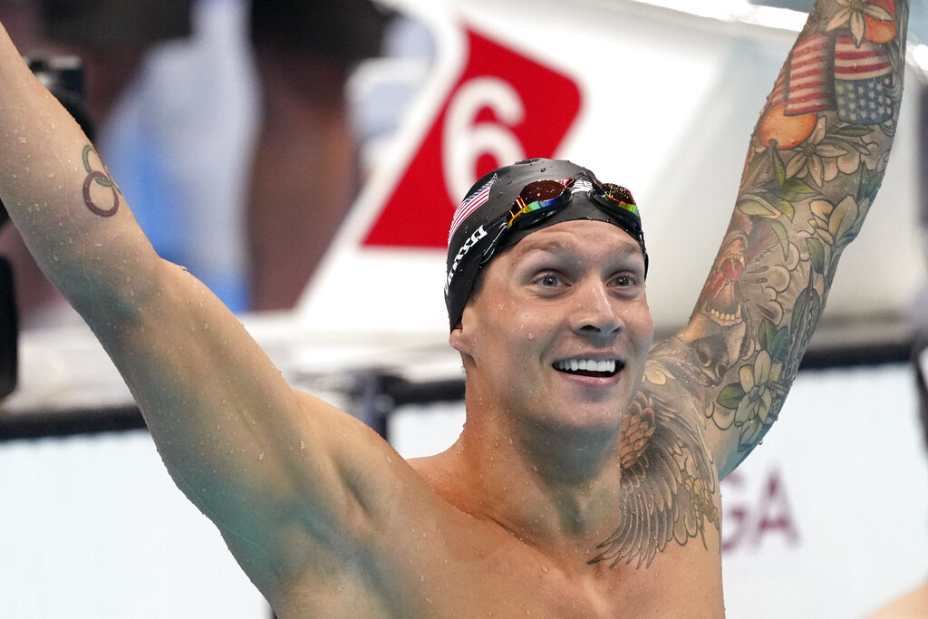 Caeleb Dressel of the United States celebrates winning the men's 100-meter freestyle final at the 2020 Summer Olympics, Thursday, July 29, 2021, in Tokyo, Japan. (AP Photo/Matthias Schrader)