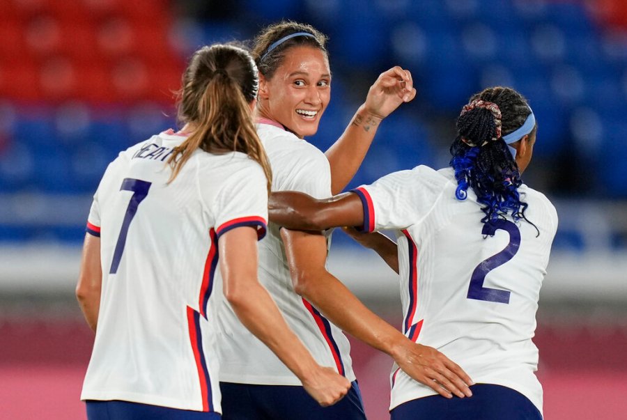 United States' Lynn Williams, center, celebrates with teammates after scoring a goal against Netherlands during a women's quarterfinal soccer match at the 2020 Summer Olympics, Friday, July 30, 2021, in Yokohama, Japan. (AP Photo/Silvia Izquierdo)